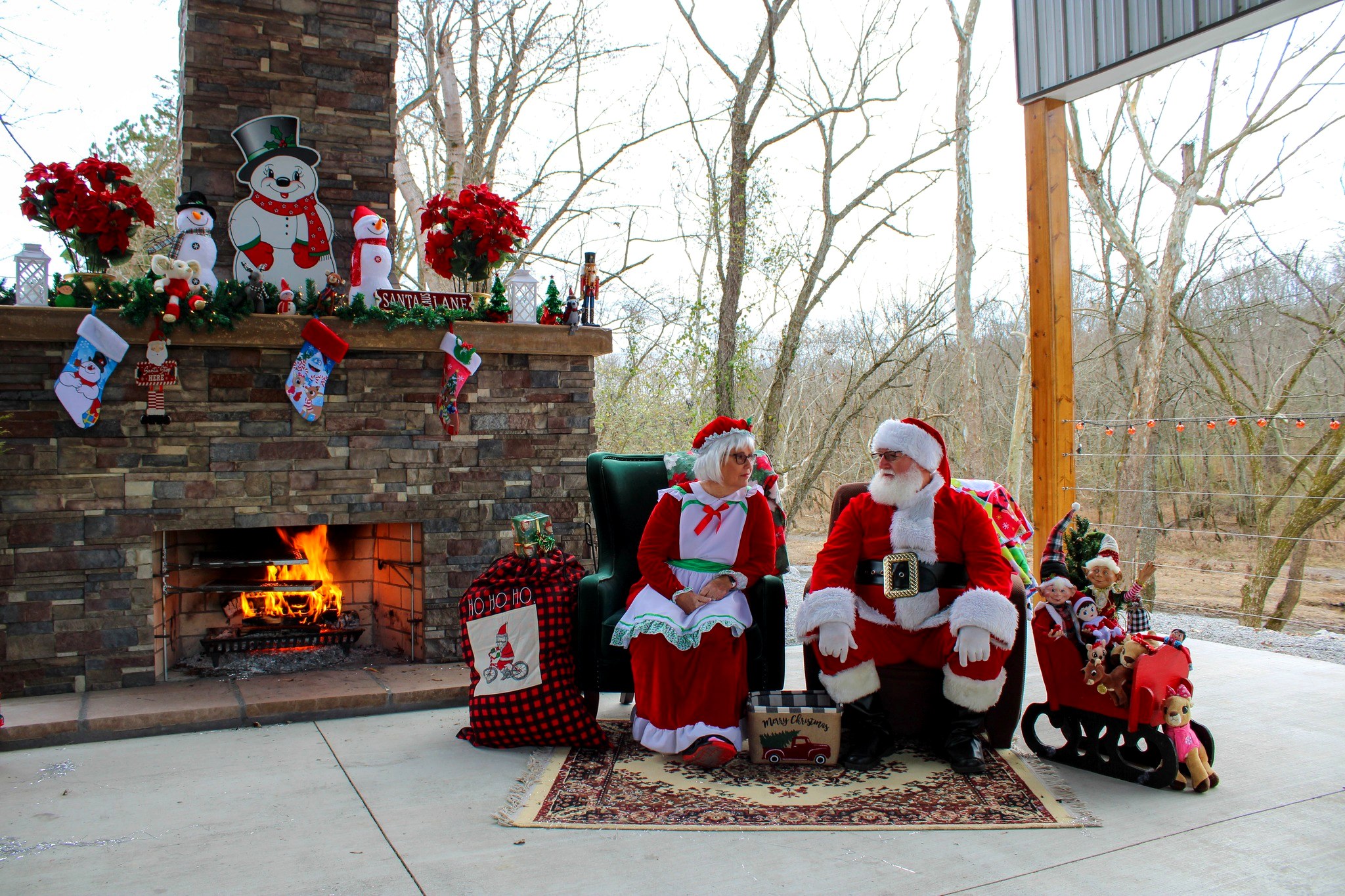 Christmas decorations on the lodge porch fireplace